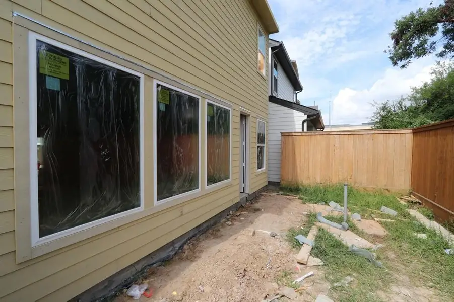 Front exterior of a new home in Retreat at Oak Park, Houston, TX, highlighting curb appeal (Image 2). Front exterior of a new home in Retreat at Oak Park, Houston, TX, highlighting curb appeal (Image 2).