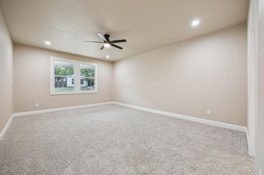 Carpeted Master bedroom with recessed lighting and ceiling fan Carpeted Master bedroom with recessed lighting and ceiling fan