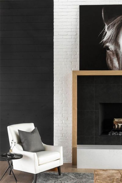 Living area featuring a fireplace and wood finished floors