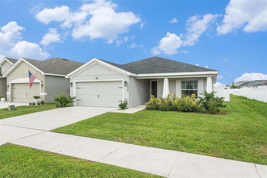 Front exterior of a new home in , Zephyrhills, FL, highlighting curb appeal (Image 21).