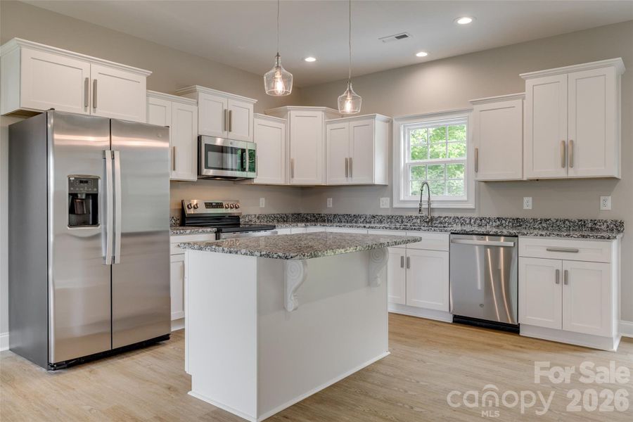 Representative photo of same build. Layout reversed per attached floorplan. Colors and selections may differ.