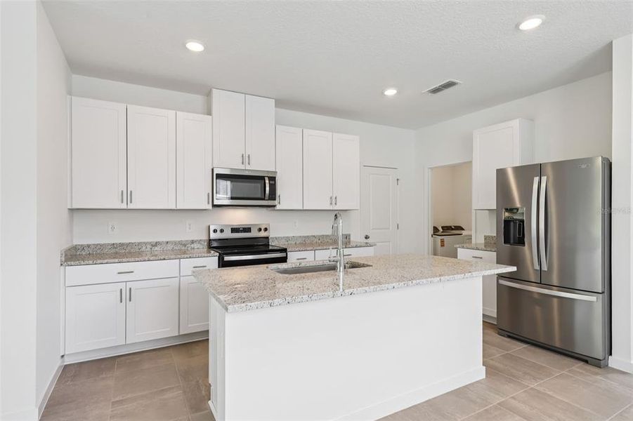 Furnished interior view inside a new home in Flagler Village - Classic Series, Palm Coast (Image 8). Furnished interior view inside a new home in Flagler Village - Classic Series, Palm Coast (Image 8).