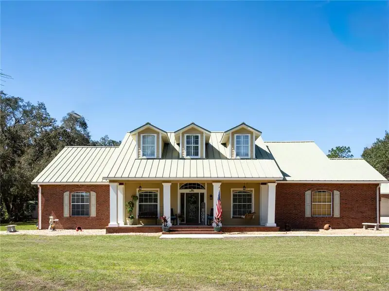 Front exterior of a new home in , Ocklawaha, FL, highlighting curb appeal (Image 20).