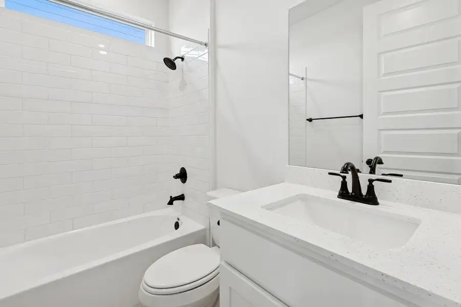 Full bath featuring washtub / shower combination and vanity