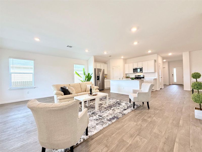 Living area featuring light wood-style floors and recessed lighting Living area featuring light wood-style floors and recessed lighting