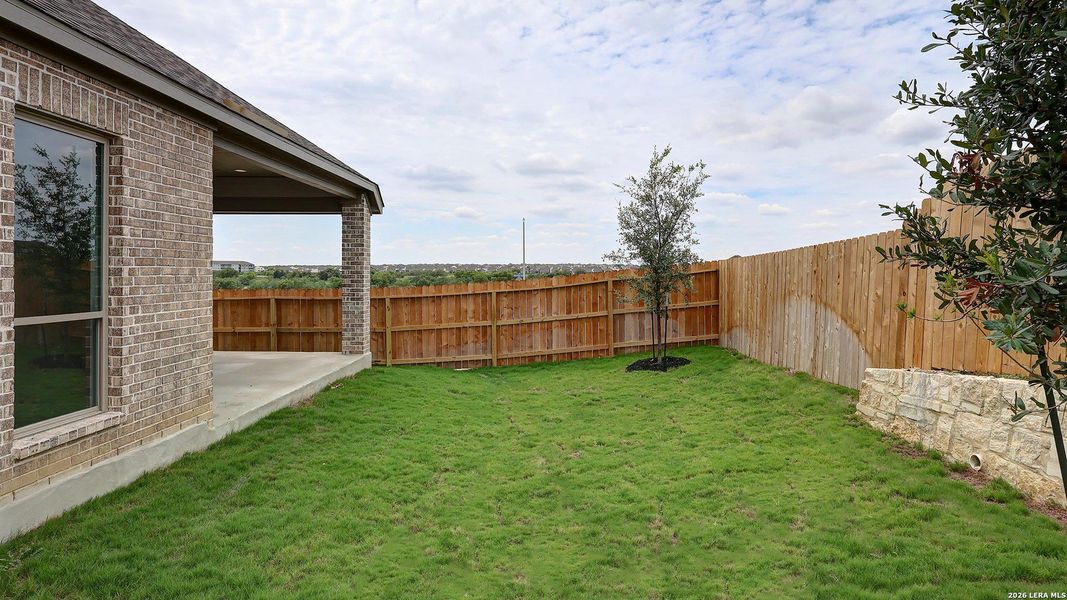 Exterior details and patio area of a home in Briggs Ranch, San Antonio (Image 24).