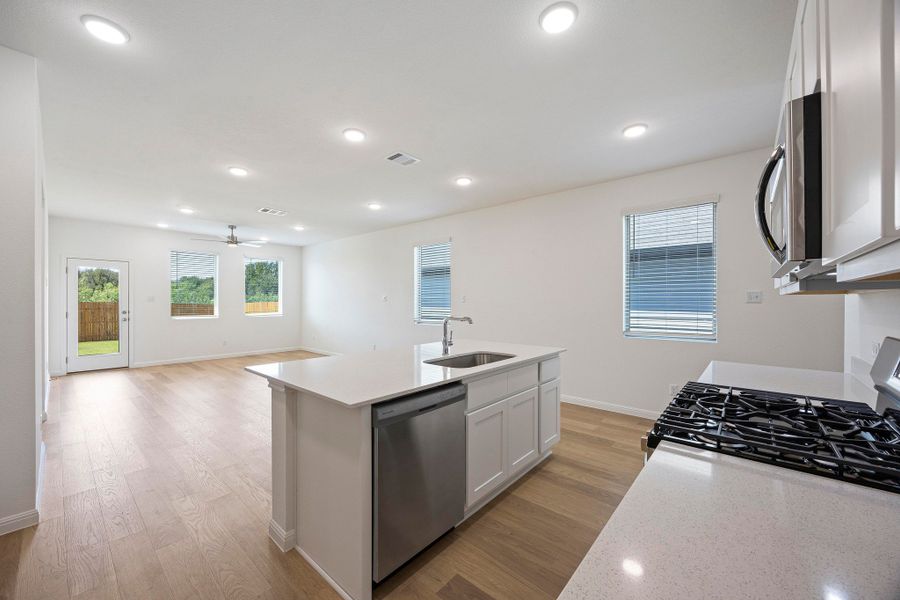 Kitchen in the Magnolia home plan by Trophy Signature Homes – REPRESENTATIVE PHOTO