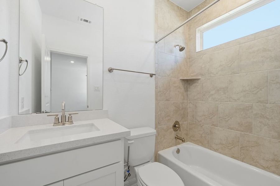 Furnished interior view inside a new home in Parkside on the River 60s, Georgetown (Image 9).