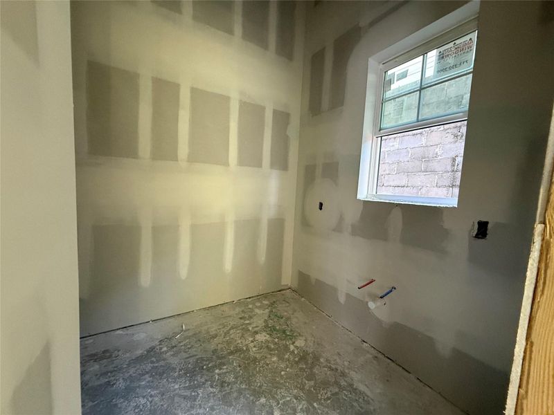 Butler pantry with tons of cabinet space, sink, and microwave. Can easily serve as a prep area or be used to hide counter top appliances in addition to storing groceries.