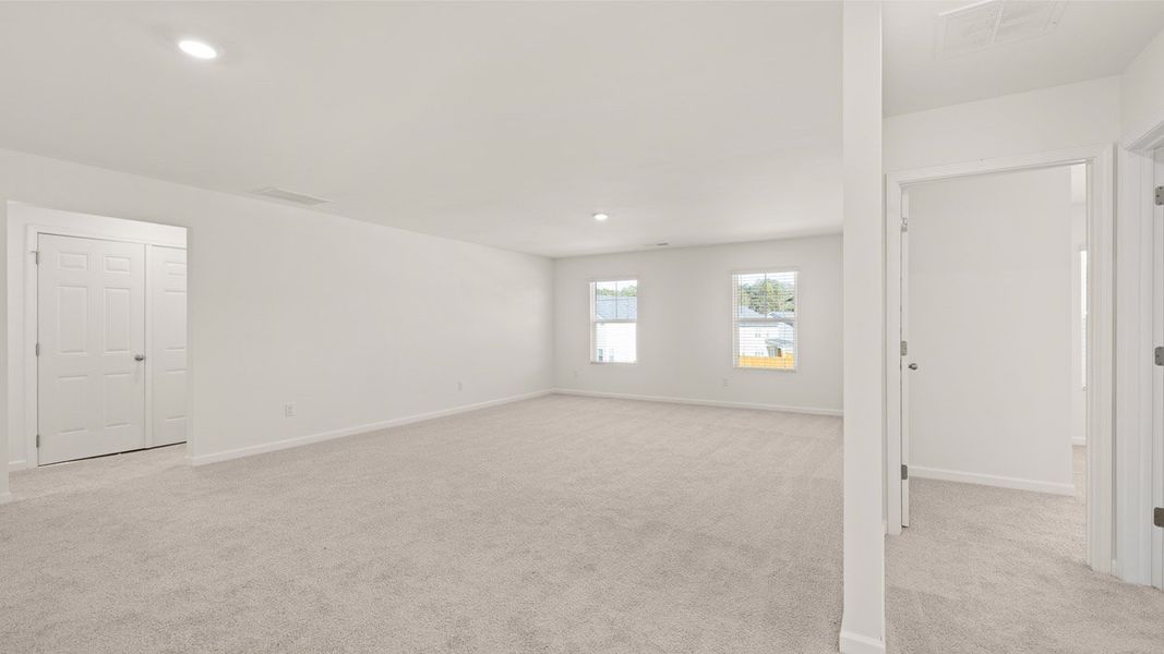 Representative unfurnished interior of a home built from the Mansfield by D.R. Horton in Brooks Station, Dacula (Image 24).