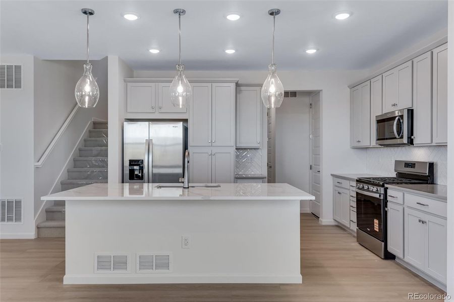 Furnished interior view inside a new home in Crescendo at The Aurora Highlands, Aurora (Image 14).