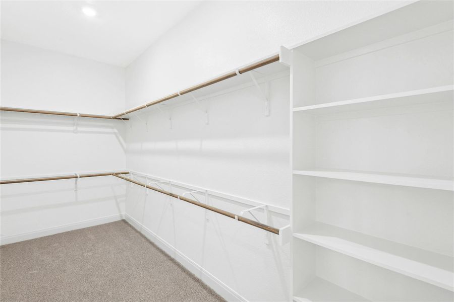 Spacious primary closet Spacious primary closet