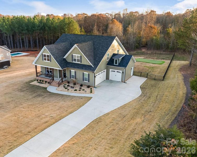 Aerial view of a semi-custom built, 1.5 story with plenty of upgrades.