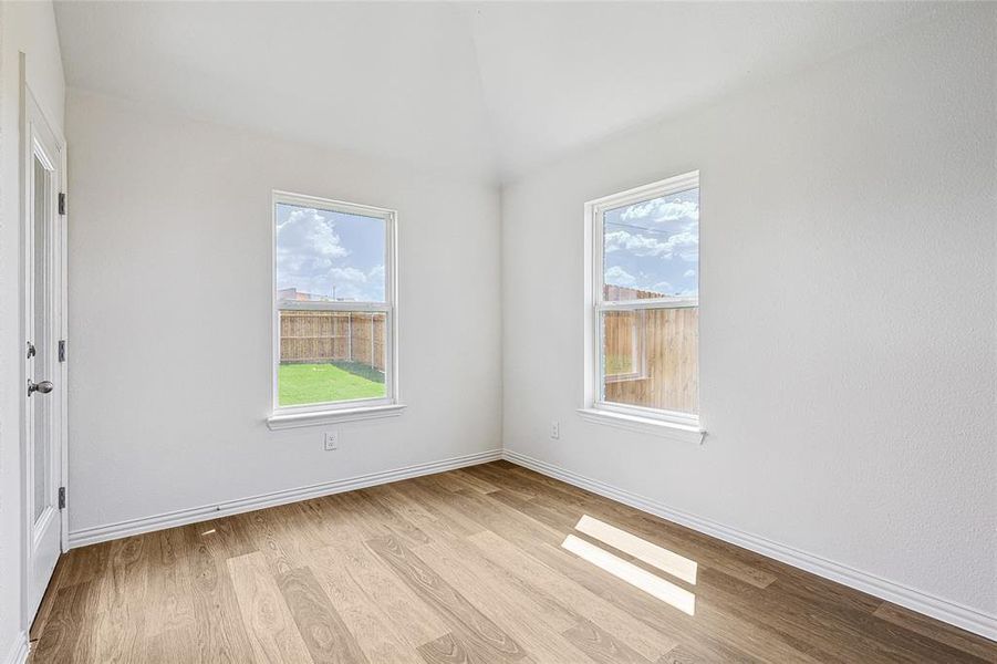 Unfurnished room with light hardwood / wood-style floors