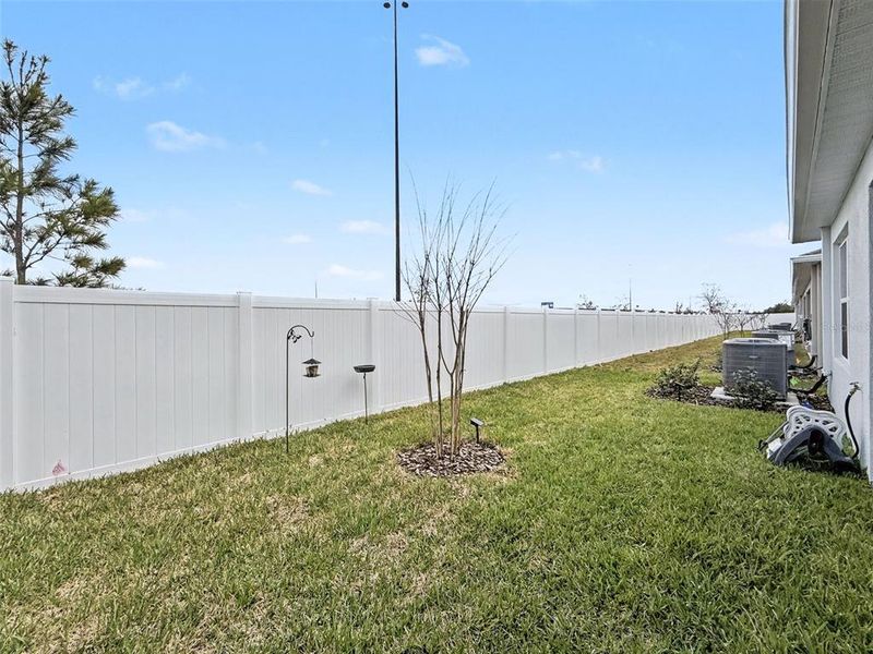 Exterior details and patio area of a home in Park Ridge Villas, Spring Hill (Image 25).