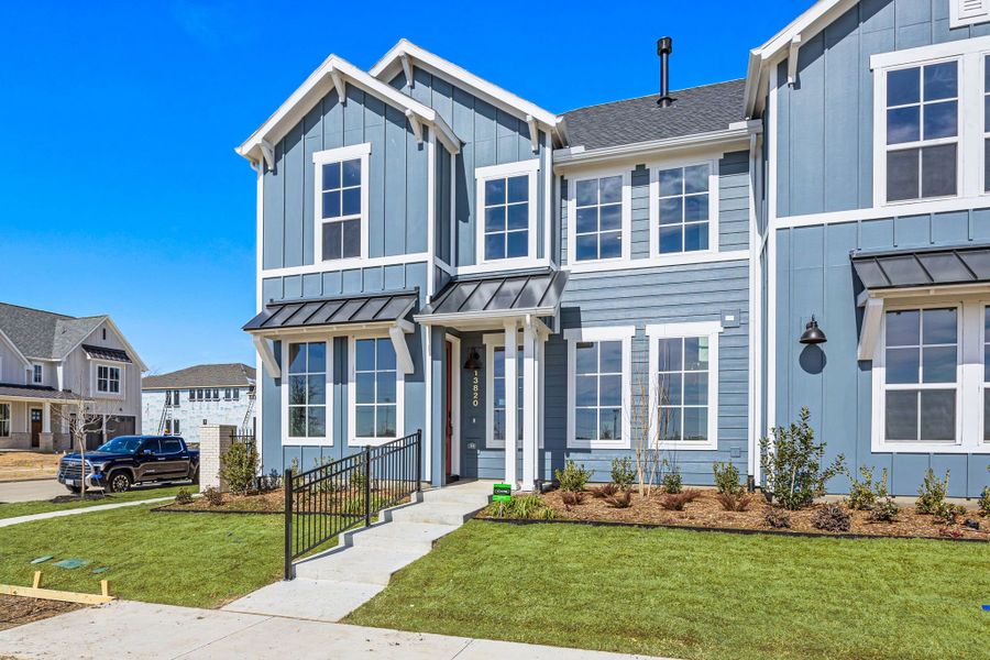Front exterior of a new home in Fields, Frisco, TX, highlighting curb appeal (Image 2). Front exterior of a new home in Fields, Frisco, TX, highlighting curb appeal (Image 2).