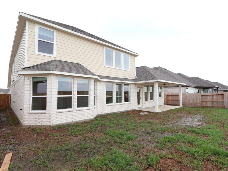 Front exterior of a new home in Marvida, Cypress, TX, highlighting curb appeal (Image 14).