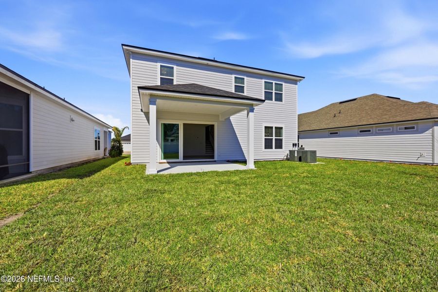 Exterior details and patio area of a home in Silver Landing At Silverleaf, St. Augustine (Image 27).