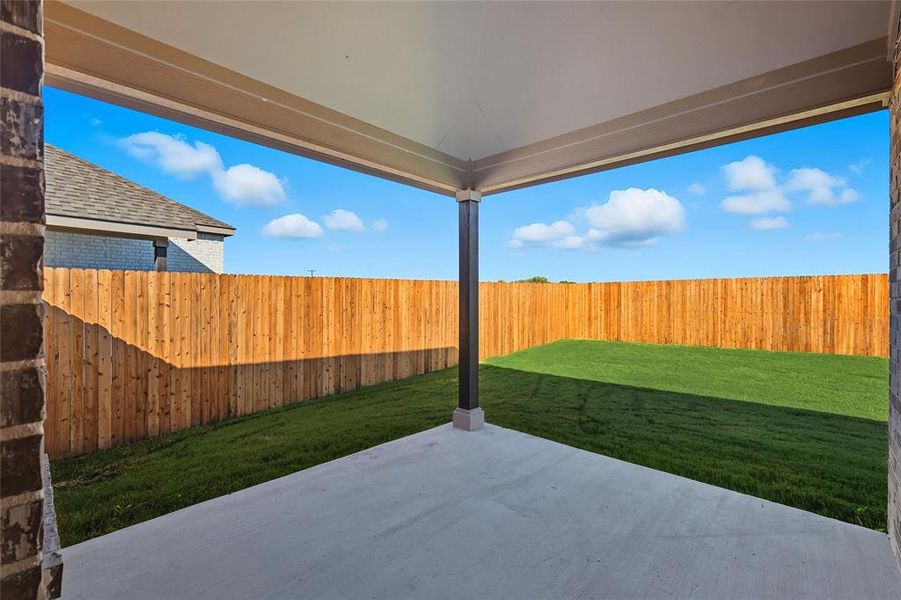 Fenced backyard featuring a patio Fenced backyard featuring a patio