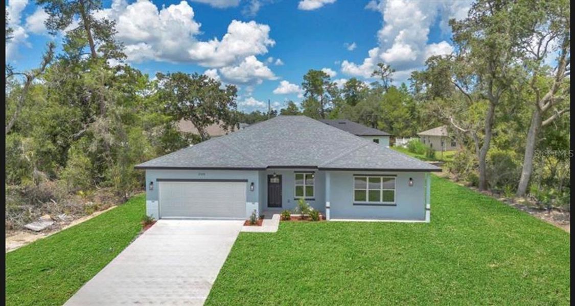 Front exterior of a new home in , Ocala, FL, highlighting curb appeal (Image 20).