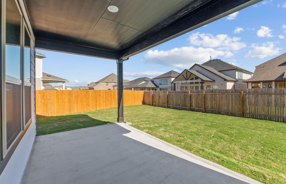 Exterior details and patio area of a home in Santa Rita Ranch, Liberty Hill (Image 24).