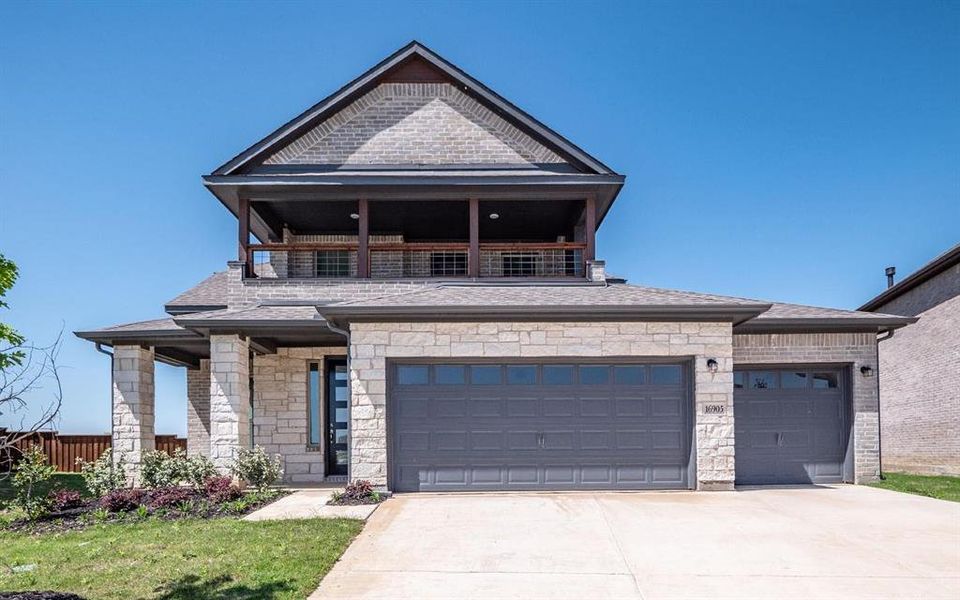 View of front facade featuring a garage View of front facade featuring a garage