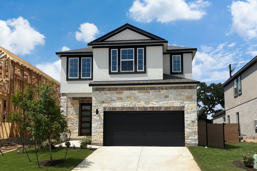 Front exterior of a new home in Highland Village, Georgetown, TX, highlighting curb appeal (Image 1). Front exterior of a new home in Highland Village, Georgetown, TX, highlighting curb appeal (Image 1).