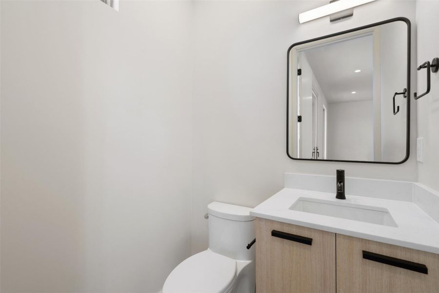 Bathroom featuring toilet and vanity