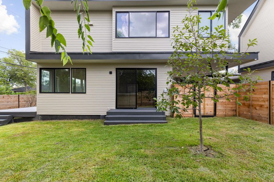 Back of house featuring entry steps