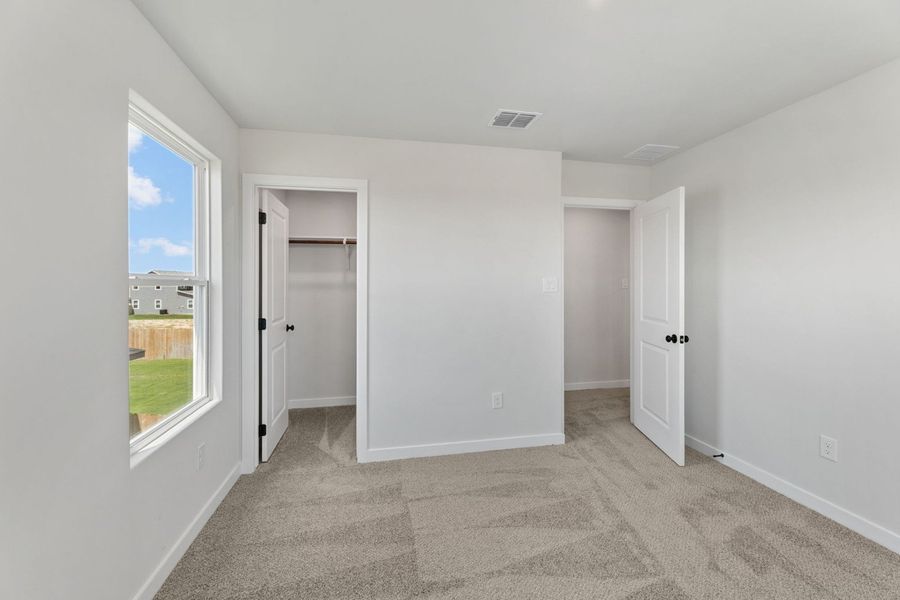 Representative unfurnished interior of a home built from the Poinsettia by Hakes Brothers in Hickory Ridge Estates, Elmendorf (Image 16).