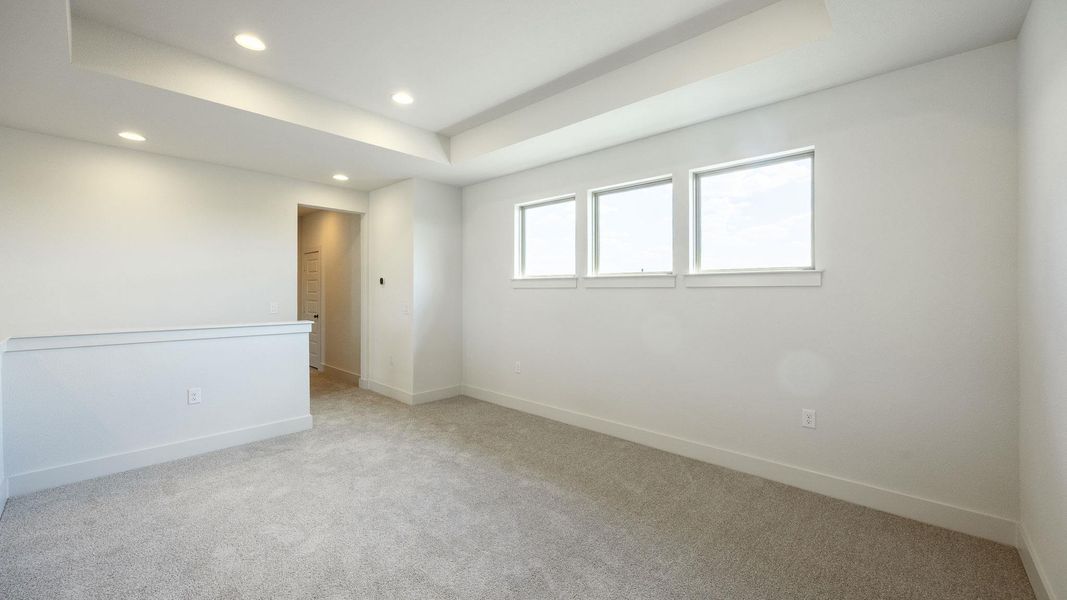 Unfurnished room featuring a raised ceiling, carpet flooring, and recessed lighting Unfurnished room featuring a raised ceiling, carpet flooring, and recessed lighting