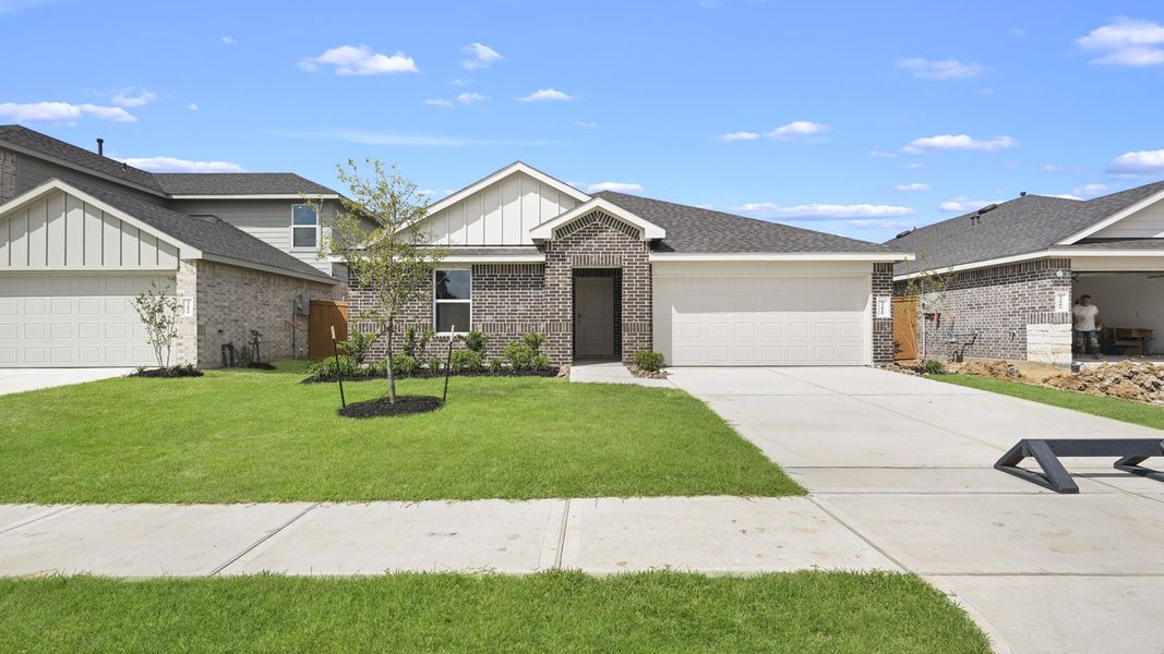 Front exterior of a new home in Cypress Green, Hockley, TX, highlighting curb appeal (Image 1). Front exterior of a new home in Cypress Green, Hockley, TX, highlighting curb appeal (Image 1).