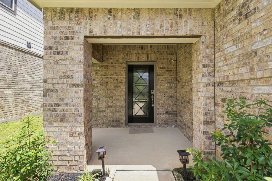 Exterior details and patio area of a home in Lakes at Black Oak, Magnolia (Image 4). Exterior details and patio area of a home in Lakes at Black Oak, Magnolia (Image 4).
