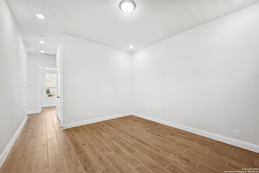 Spacious, unfurnished interior of a new home in Windsong - Legacy Series, Boerne (Image 22).