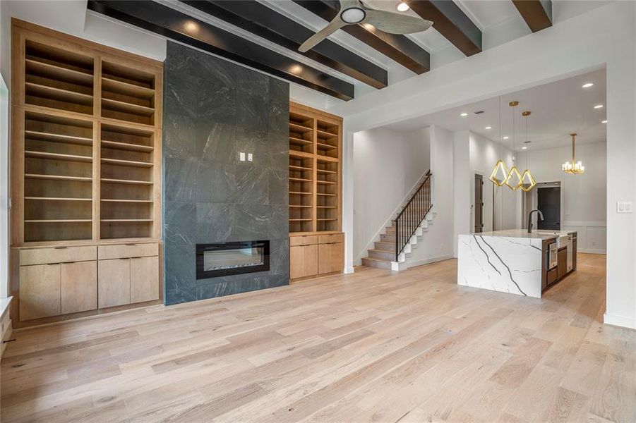 Welcome to your gorgeous living room with custom built-in shelves & tiled fireplace. Notice that it's already been wired for a TV above your fireplace.