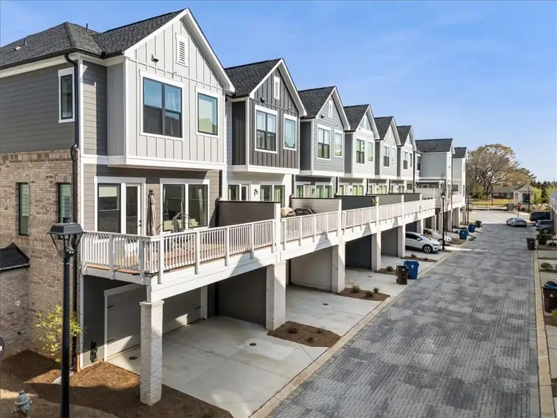 Front exterior of a new home in , Alpharetta, GA, highlighting curb appeal (Image 2). Front exterior of a new home in , Alpharetta, GA, highlighting curb appeal (Image 2).
