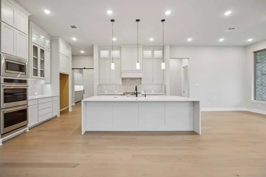 Furnished interior view inside a new home in The Grove Frisco, Frisco (Image 4).