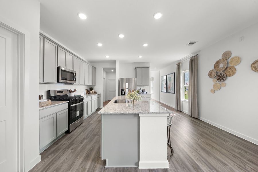 A kitchen with a marble island. A kitchen with a marble island.