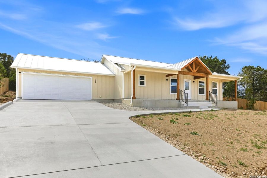 Front exterior of a new home in , Fischer, TX, highlighting curb appeal (Image 30).