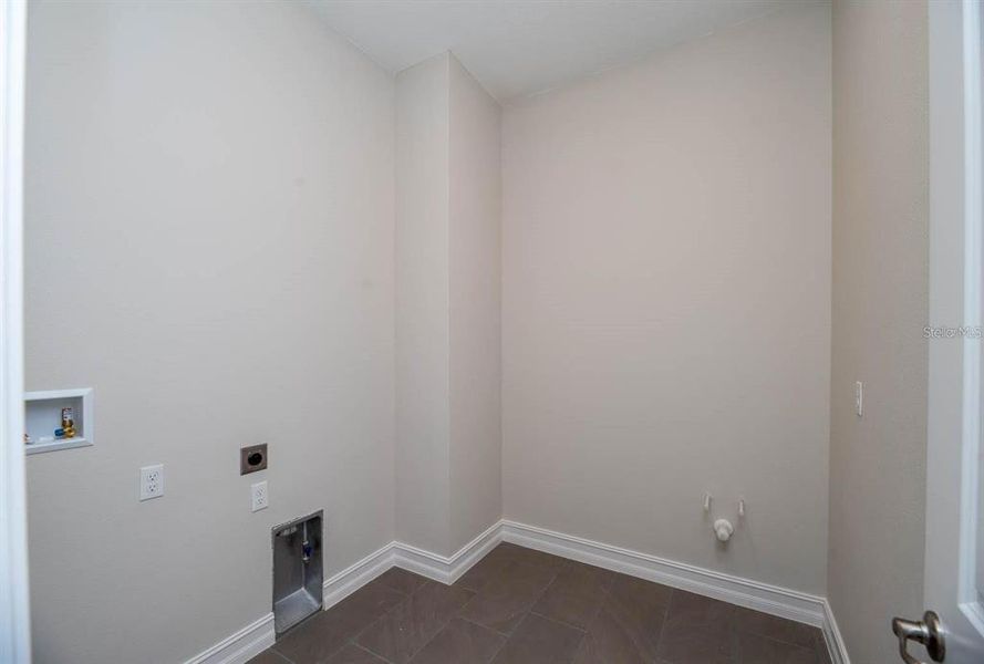 Laundry room with gas dryer & plumbed for sink