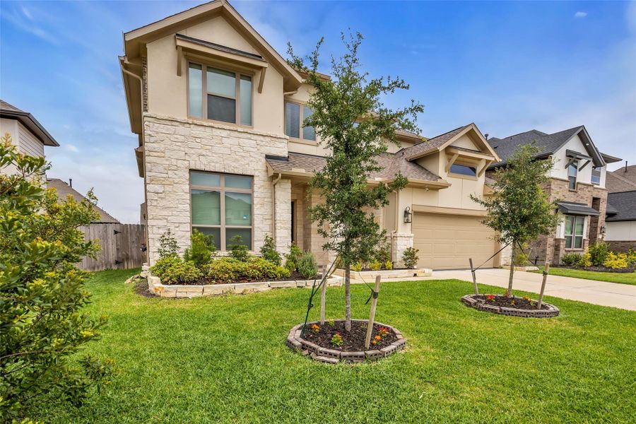 Front exterior of a new home in , Conroe, TX, highlighting curb appeal (Image 23).