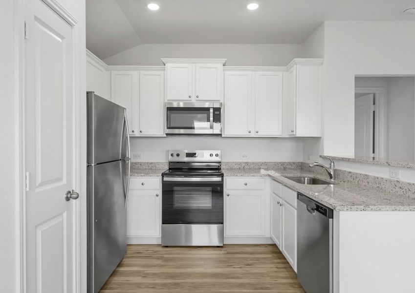 Stainless steel appliances and granite countertops in the kitchen