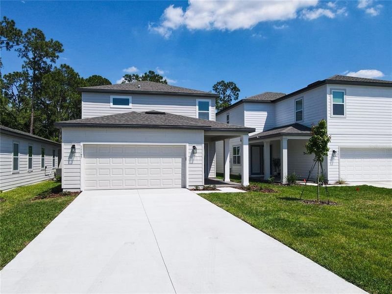 Front exterior of a new home in , Winter Garden, FL, highlighting curb appeal (Image 25).