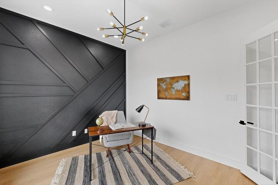 Office space featuring a chandelier and wood finished floors