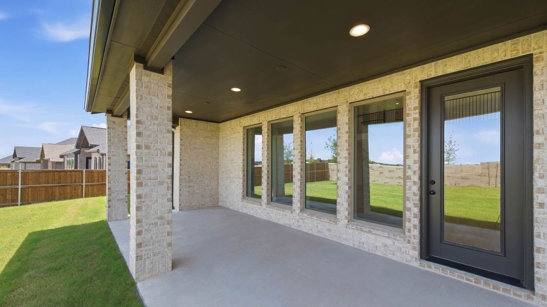 Exterior details and patio area of a home in Trinity Falls, McKinney (Image 3). Exterior details and patio area of a home in Trinity Falls, McKinney (Image 3).