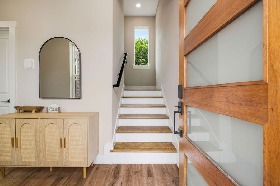 Welcoming entry with a statement front door, soaring ceilings, and a bright, open feel. Welcoming entry with a statement front door, soaring ceilings, and a bright, open feel.