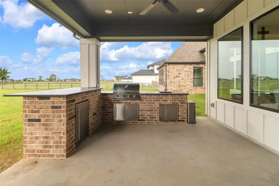 Covered patio with outdoor kitchen.