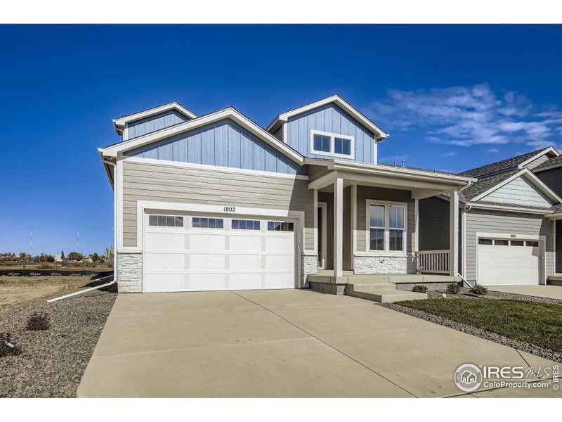 Front exterior of a new home in , Fort Collins, CO, highlighting curb appeal (Image 1). Front exterior of a new home in , Fort Collins, CO, highlighting curb appeal (Image 1).