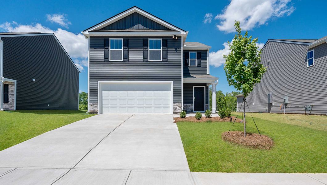 Front exterior of a new home in Gibson Grove, Laurens, SC, highlighting curb appeal (Image 1). Front exterior of a new home in Gibson Grove, Laurens, SC, highlighting curb appeal (Image 1).