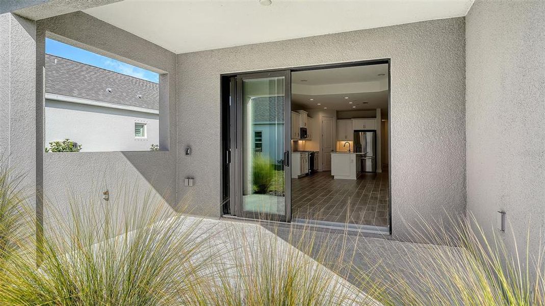Exterior details and patio area of a home in Canoe Creek, Parrish (Image 3).